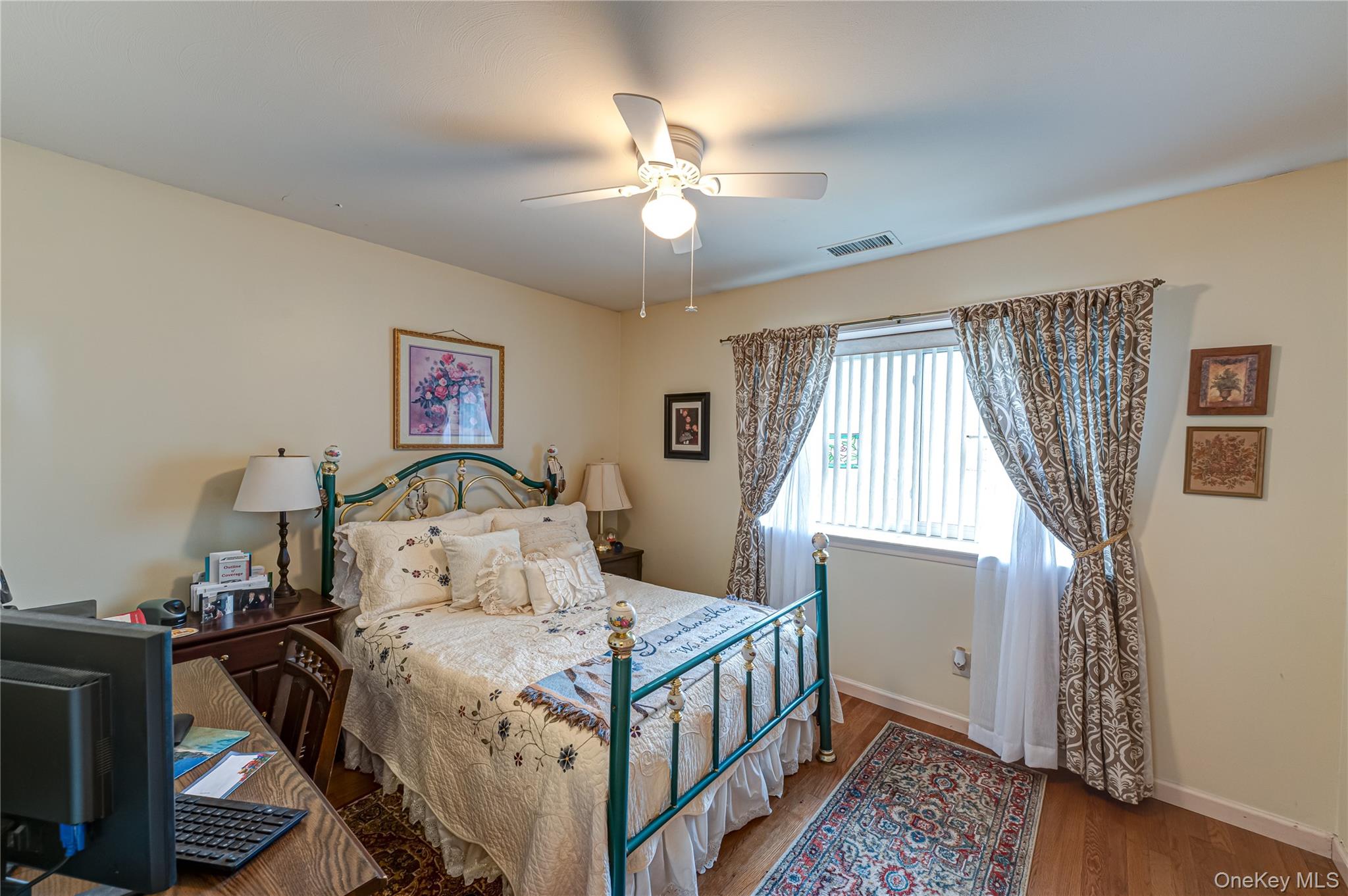 12 Blue Point Road East, Unit 12 Holtsville, NY 11742 - Photo 19 of 20 a bedroom with a bed and a window