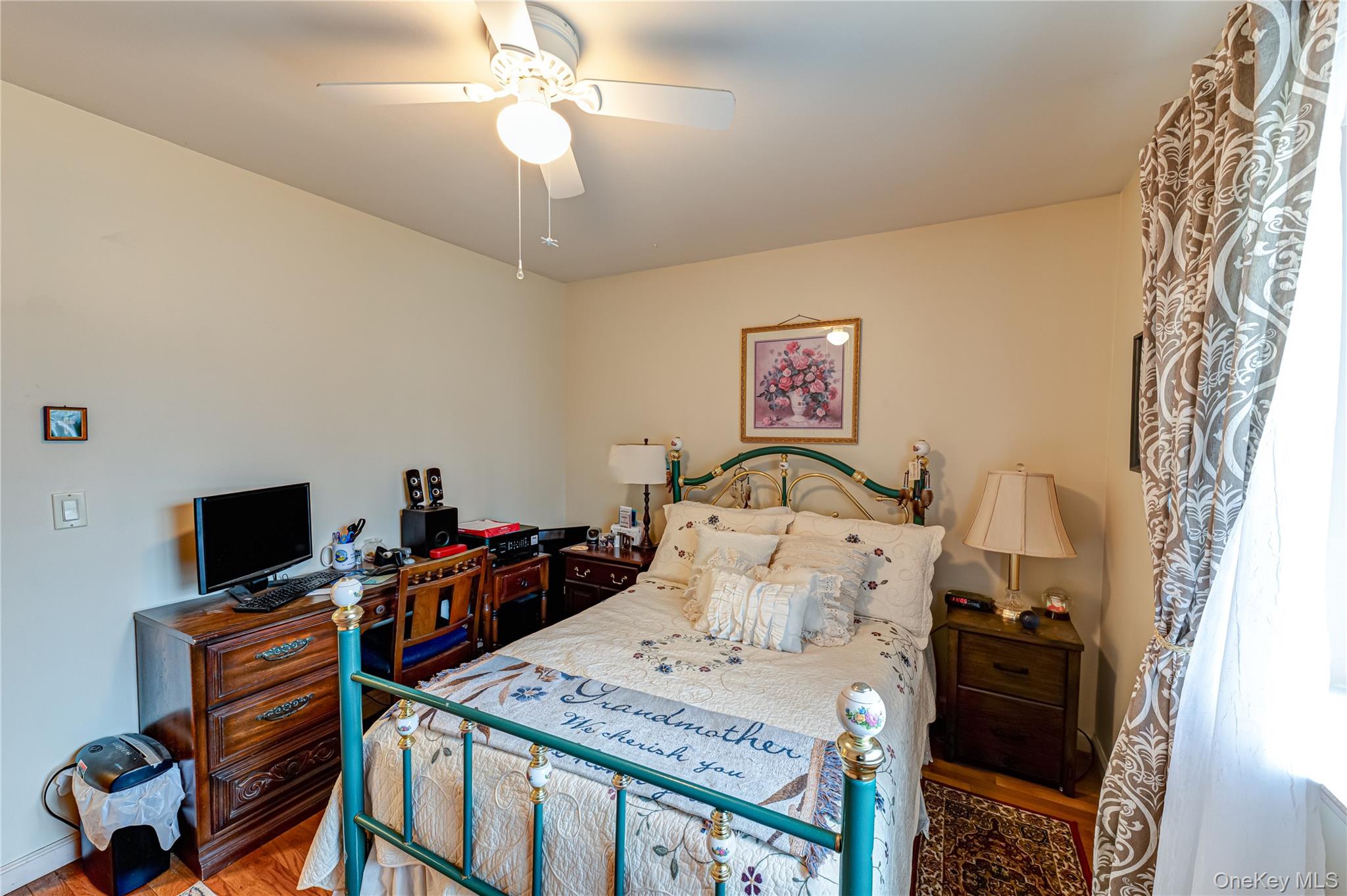 12 Blue Point Road East, Unit 12 Holtsville, NY 11742 - Photo 20 of 20 a bed room with a bed and a television