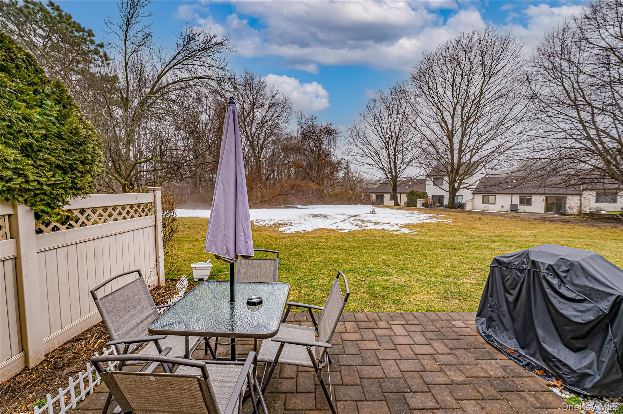 12 Blue Point Road East, Unit 12 Holtsville, NY 11742 - Photo 3 of 20 a view of a chairs and table on the terrace