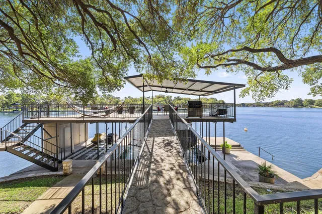 a view of balcony with wooden floor and outdoor seating