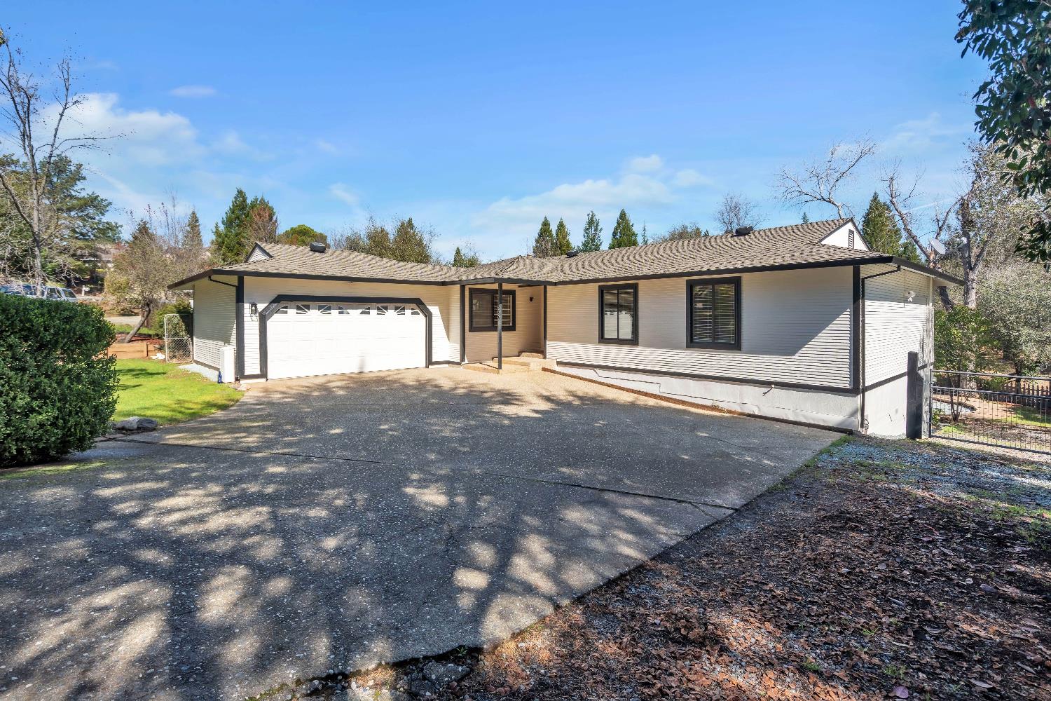 3569 Cambridge Road Cameron Park, CA 95682 - Photo 1 of 1 a front view of a house with a yard
