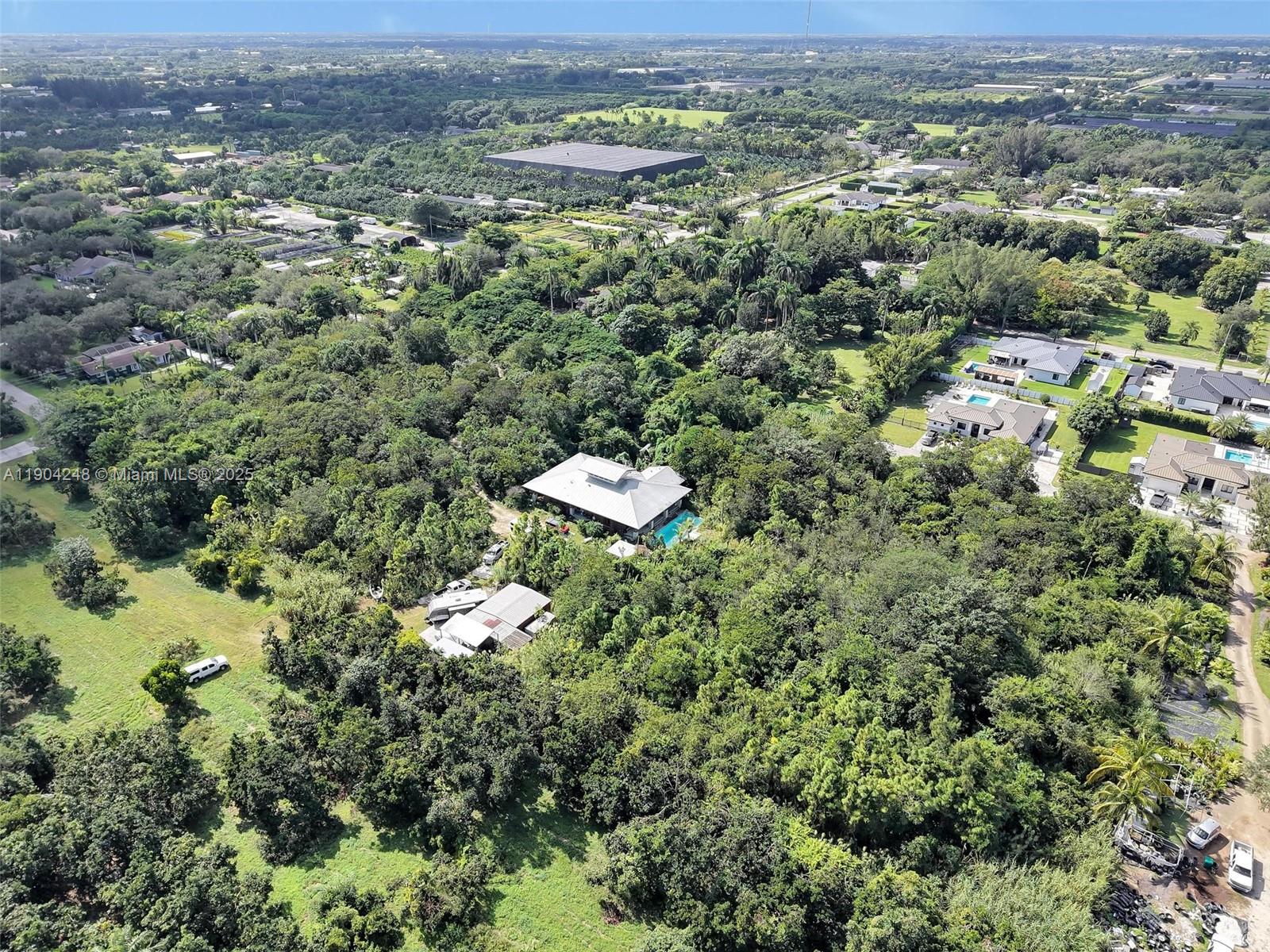 23051 Southwest 153rd Court Miami, FL 33170 - Photo 12 of 33 an aerial view of a city with lots of residential buildings