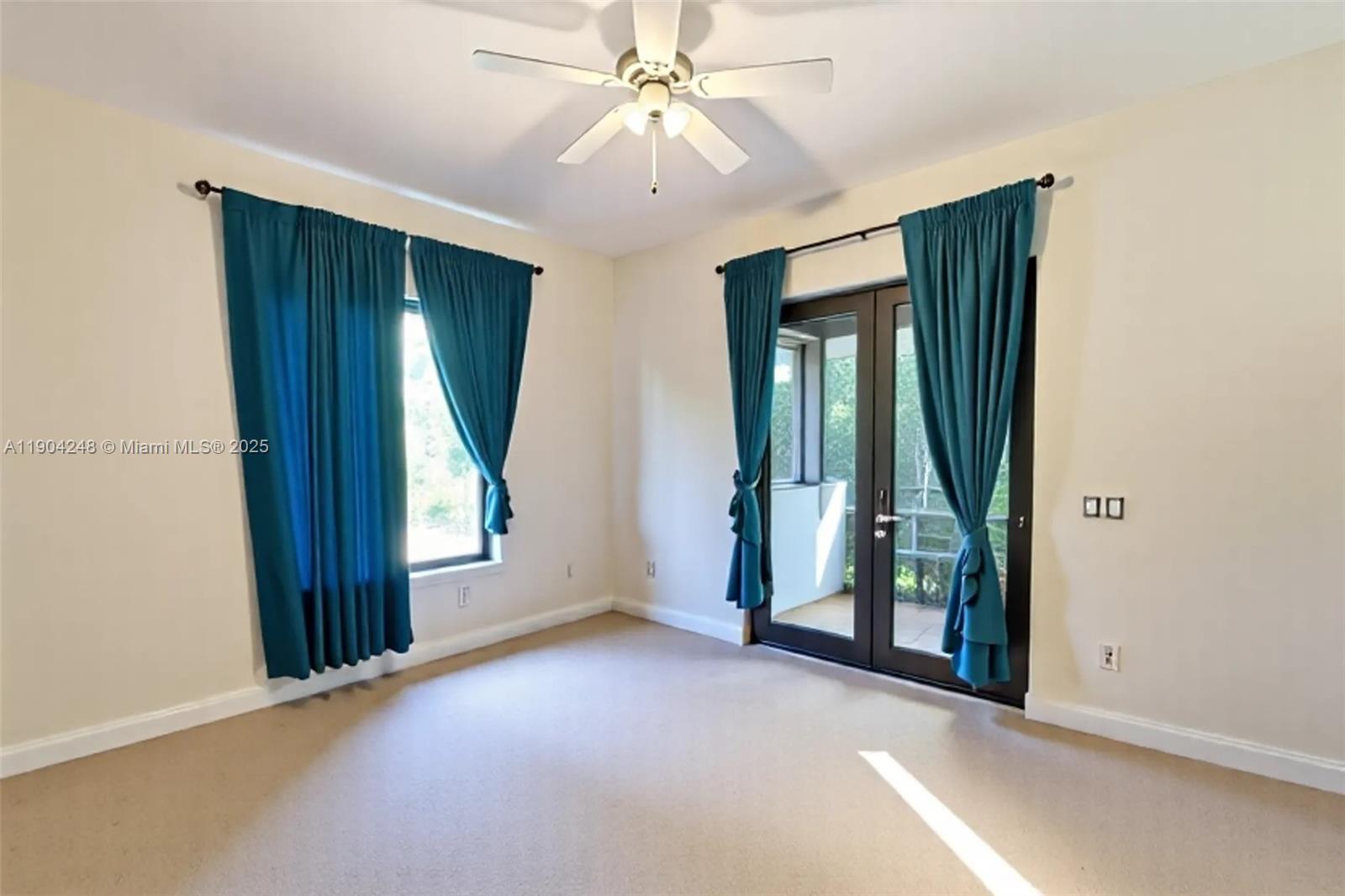 23051 Southwest 153rd Court Miami, FL 33170 - Photo 18 of 33 an empty room with windows and fan