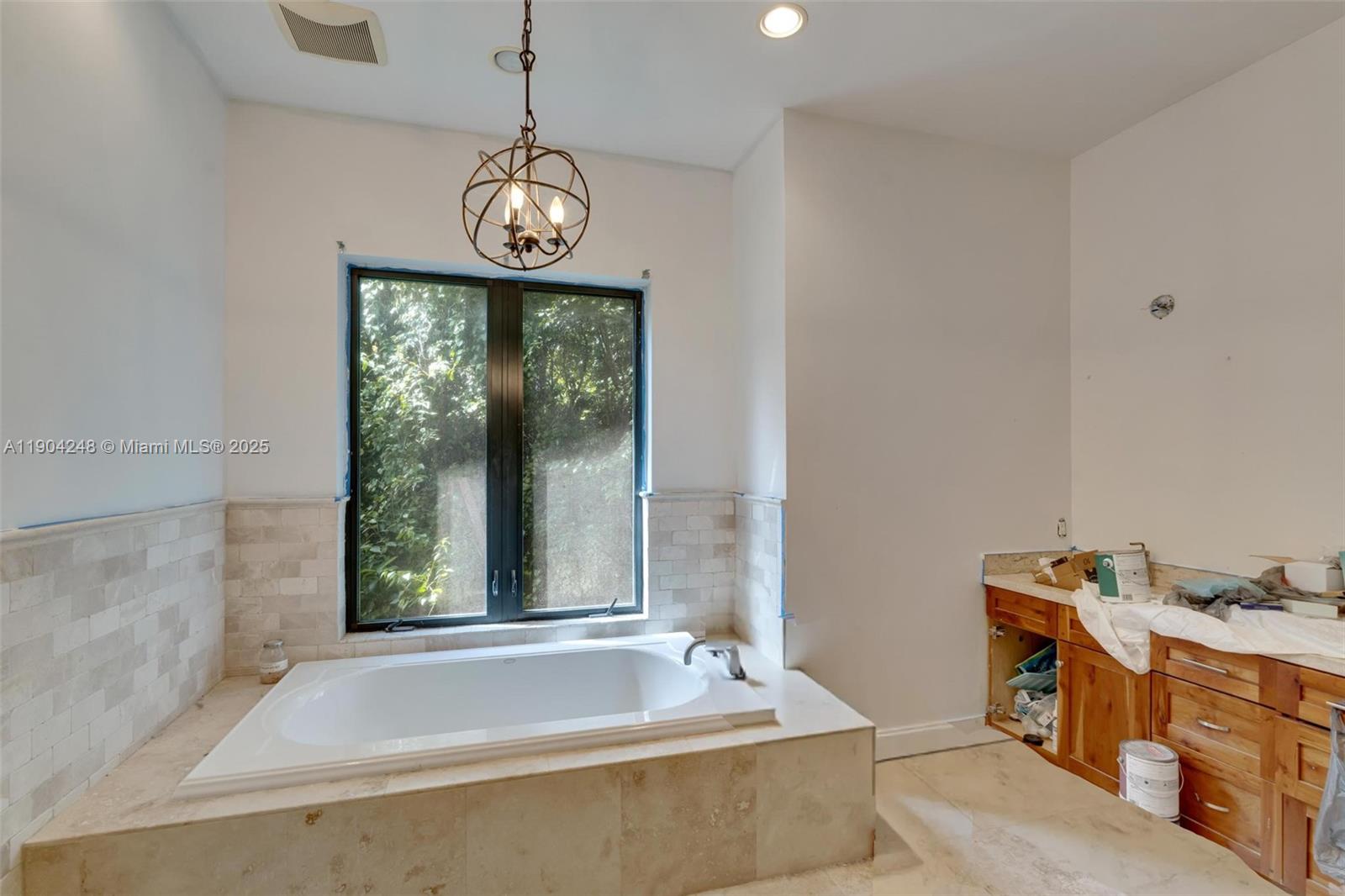23051 Southwest 153rd Court Miami, FL 33170 - Photo 24 of 33 a bathroom with a tub a sink and a window