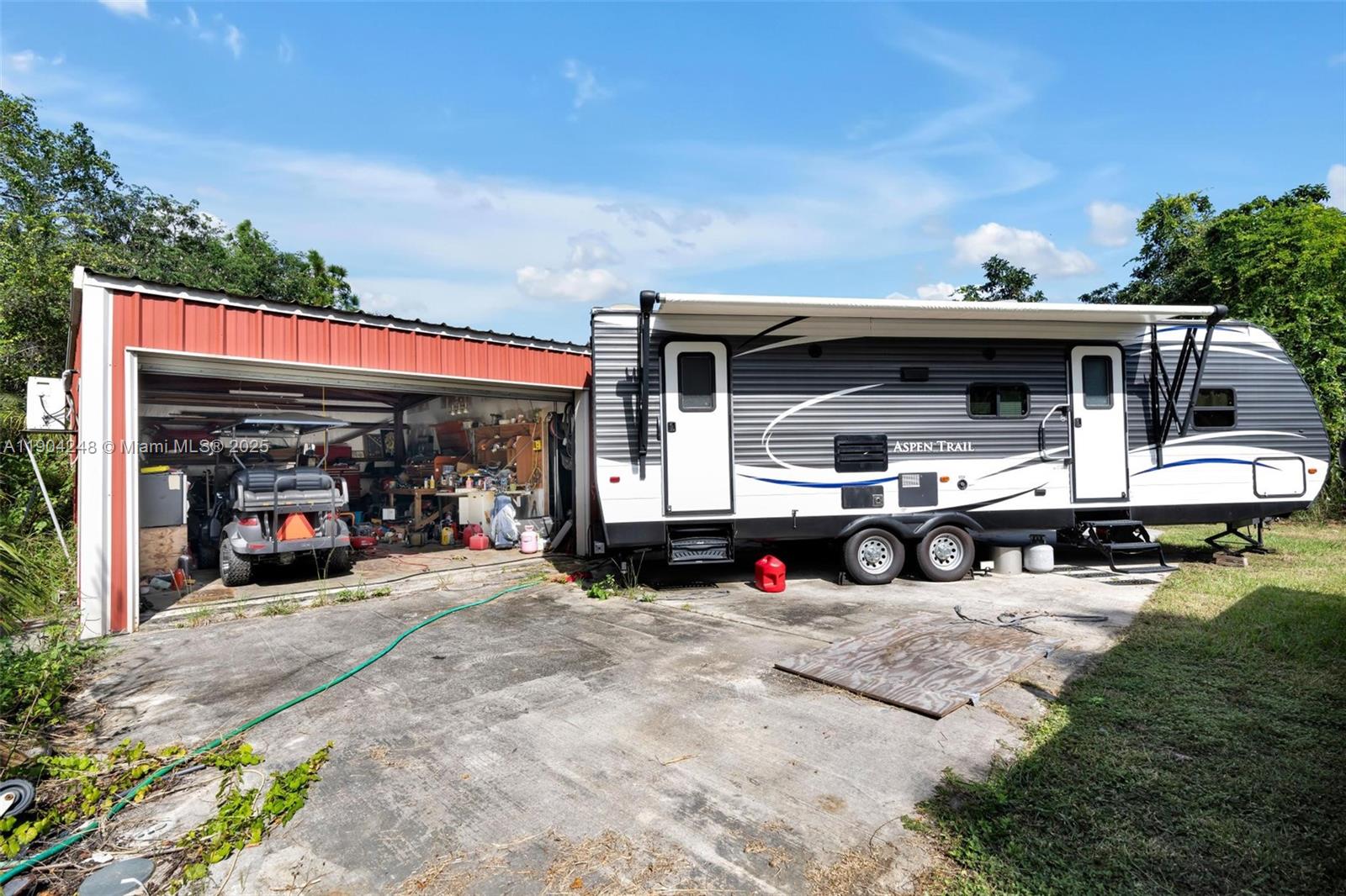 23051 Southwest 153rd Court Miami, FL 33170 - Photo 28 of 33 a view of a lounge chairs in the patio