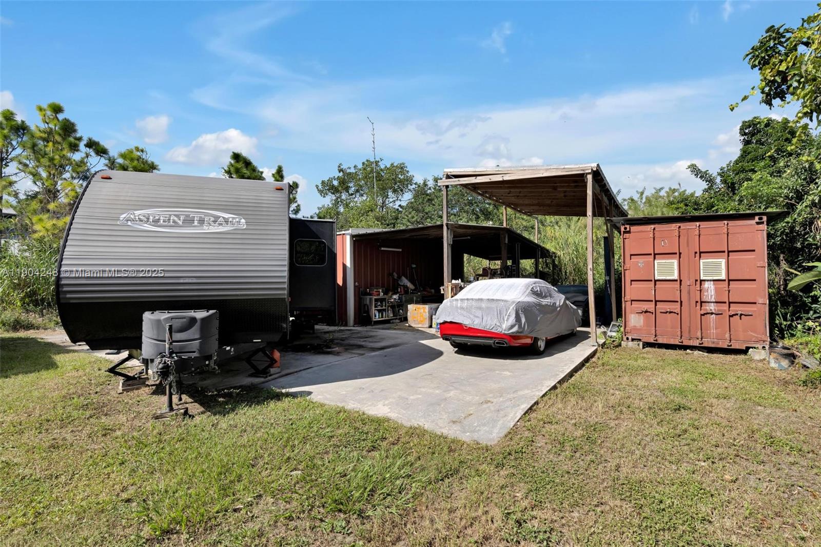 23051 Southwest 153rd Court Miami, FL 33170 - Photo 29 of 33 a car parked in front of a house