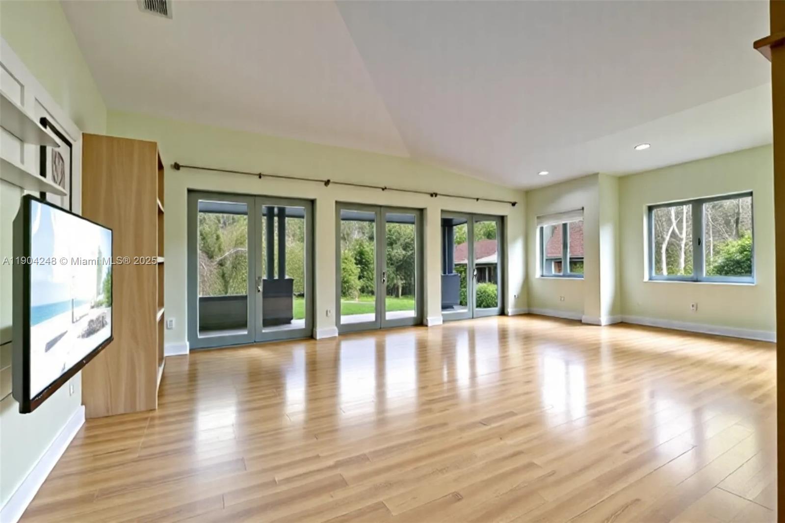 23051 Southwest 153rd Court Miami, FL 33170 - Photo 7 of 33 a view of an entryway with wooden floor and garden