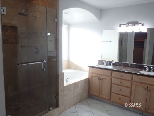 421 Marlene Court Ridgecrest, CA 93555 - Photo 25 of 50 a bathroom with a double vanity sink and mirror