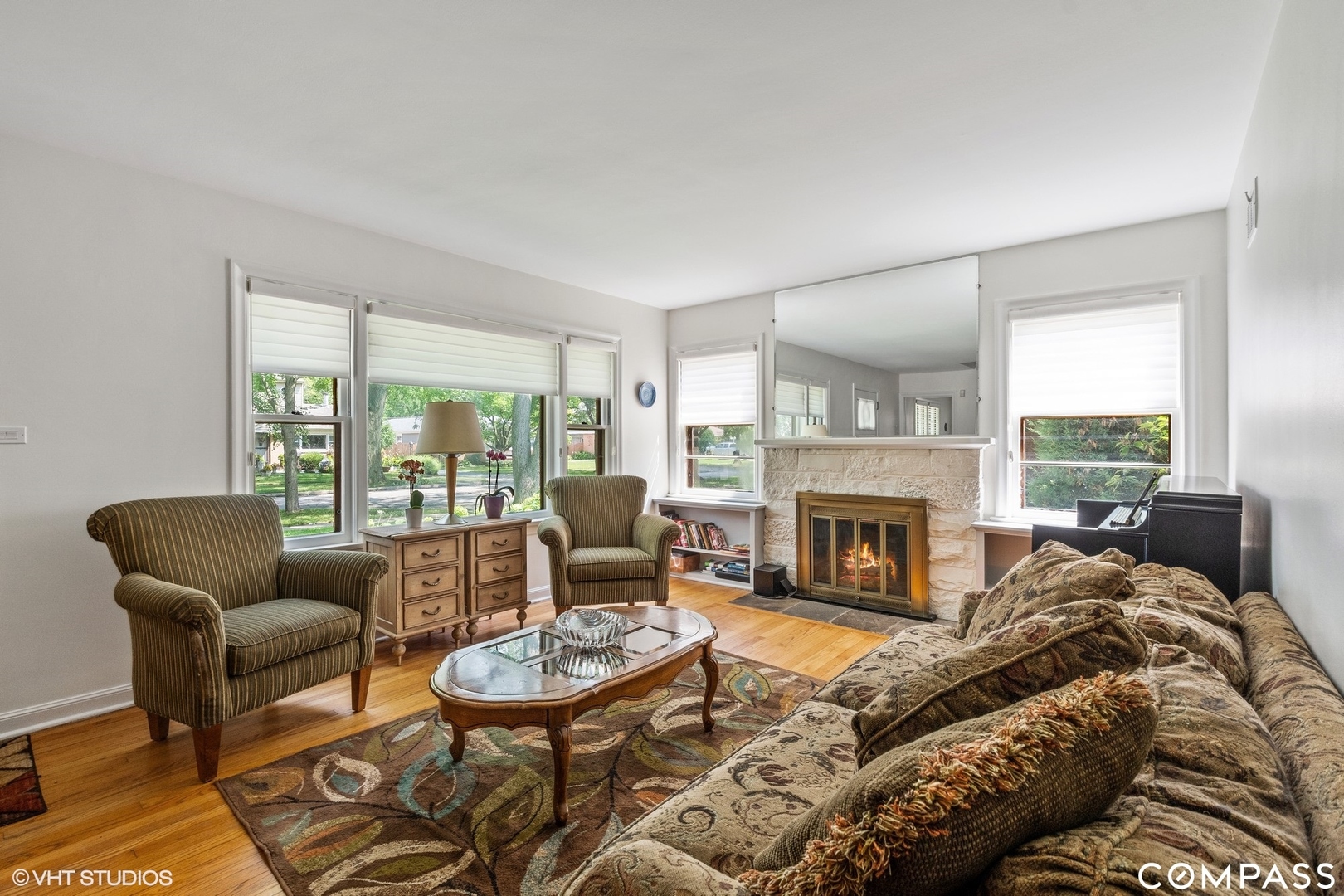 706 Deerpath Drive Deerfield, IL 60015 - Photo 2 of 11 a living room with furniture a fireplace and a large window
