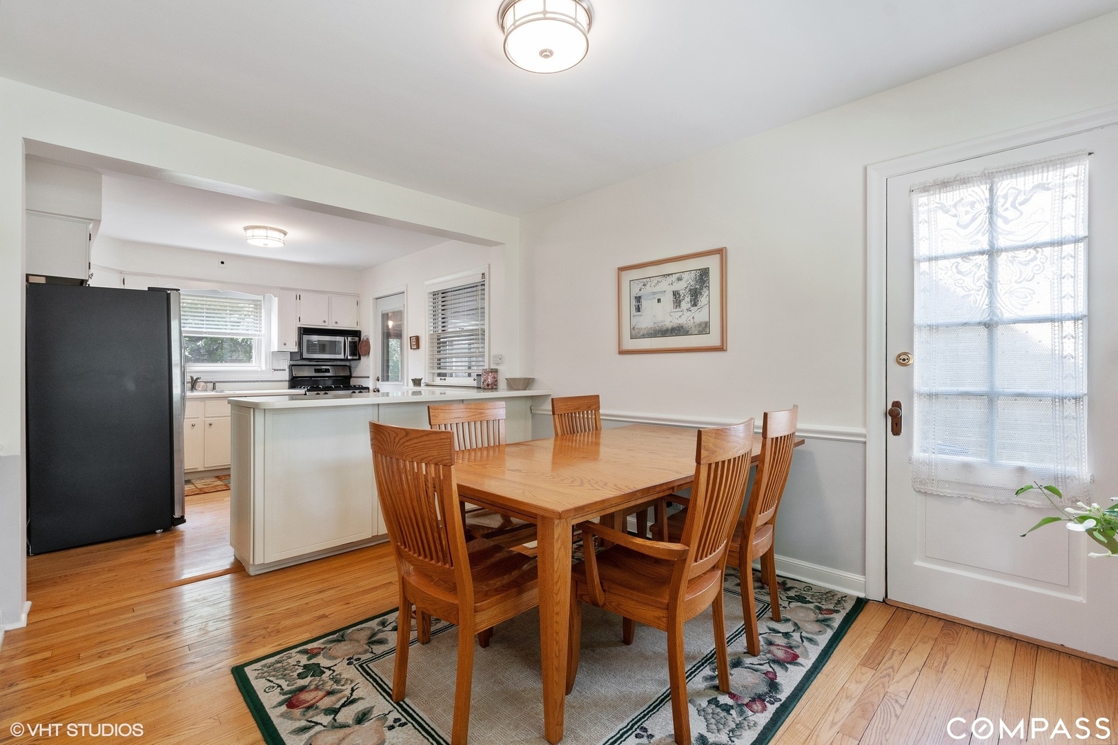 706 Deerpath Drive Deerfield, IL 60015 - Photo 4 of 11 a view of a dining room with furniture and wooden floor