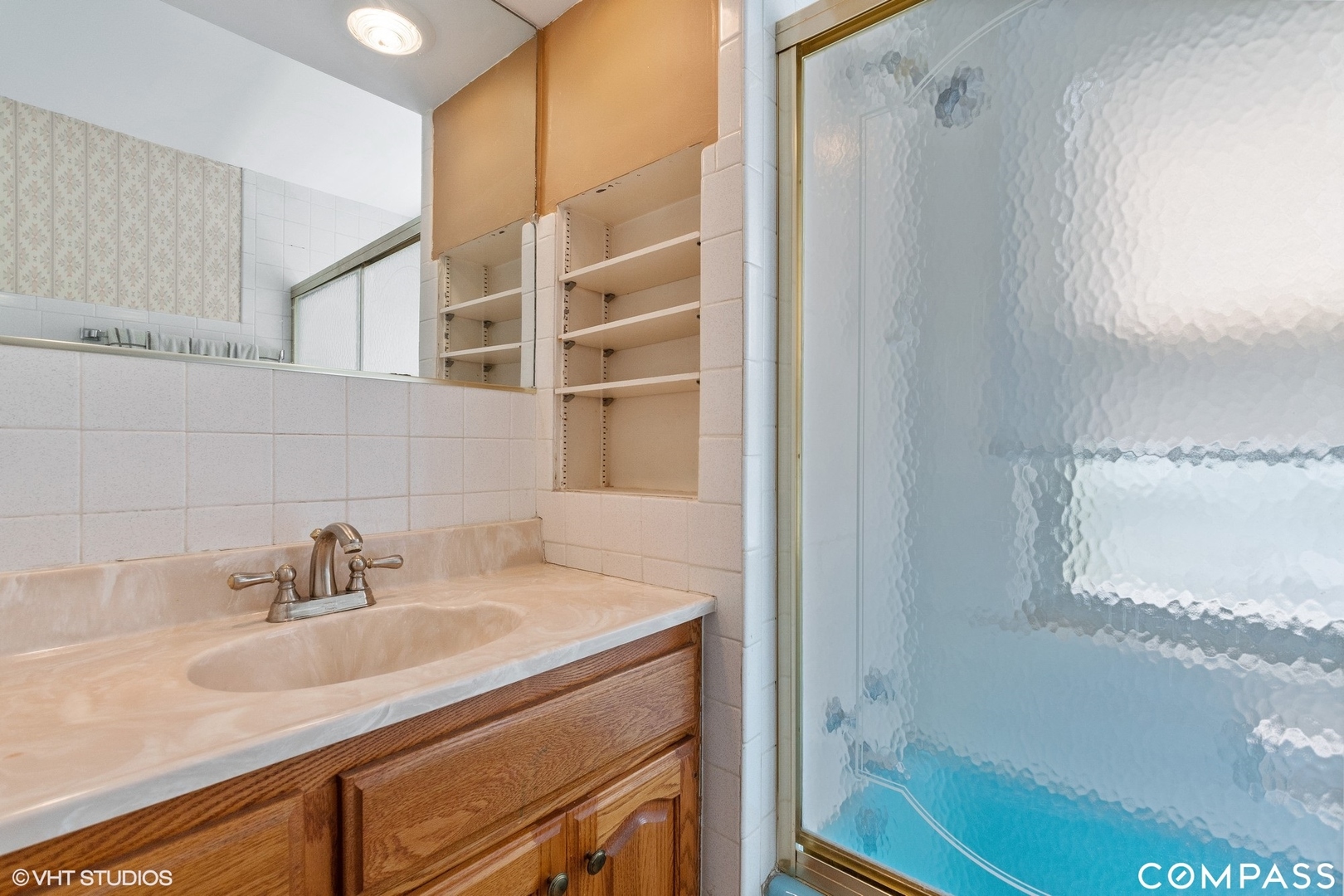 706 Deerpath Drive Deerfield, IL 60015 - Photo 7 of 11 a bathroom with a sink and a mirror