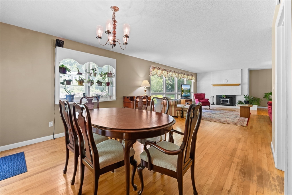 46 Highland Road Boxford, MA 01921 - Photo 12 of 41 a dining room with furniture a livingroom and chandelier