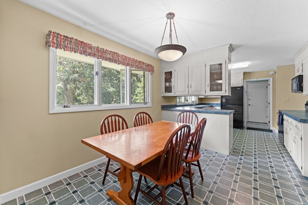 46 Highland Road Boxford, MA 01921 - Photo 18 of 41 a dining room with furniture and window