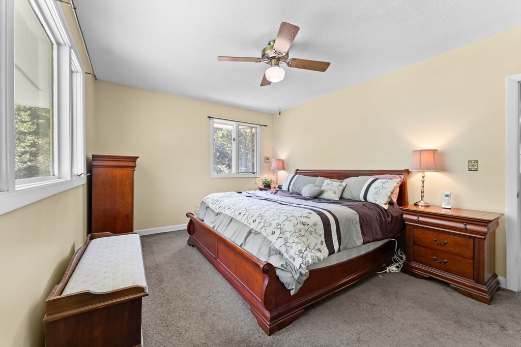 46 Highland Road Boxford, MA 01921 - Photo 19 of 41 a bedroom with a bed and window