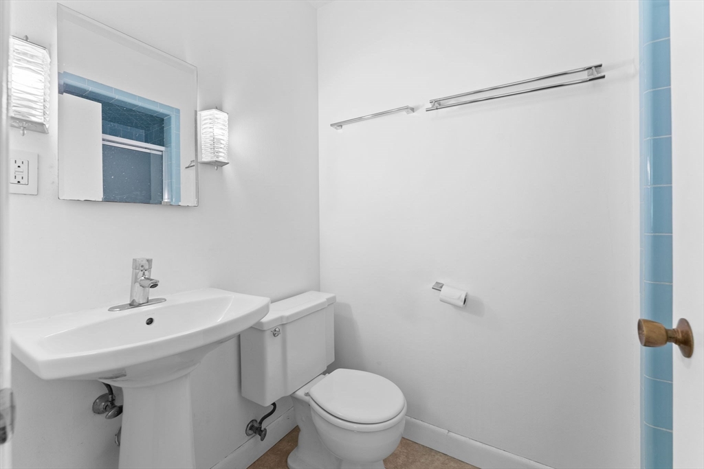 46 Highland Road Boxford, MA 01921 - Photo 21 of 41 a bathroom with a sink a toilet and shower