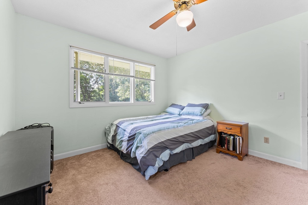 46 Highland Road Boxford, MA 01921 - Photo 24 of 41 a bedroom with a bed and a chair