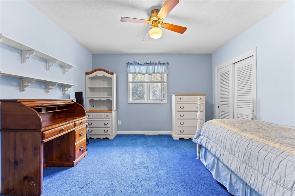 46 Highland Road Boxford, MA 01921 - Photo 26 of 41 a bedroom with a bed and a tv