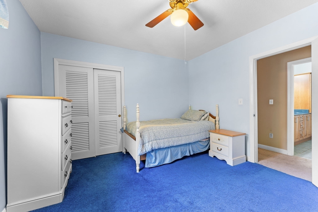 46 Highland Road Boxford, MA 01921 - Photo 27 of 41 a spacious bedroom with a bed and a closet