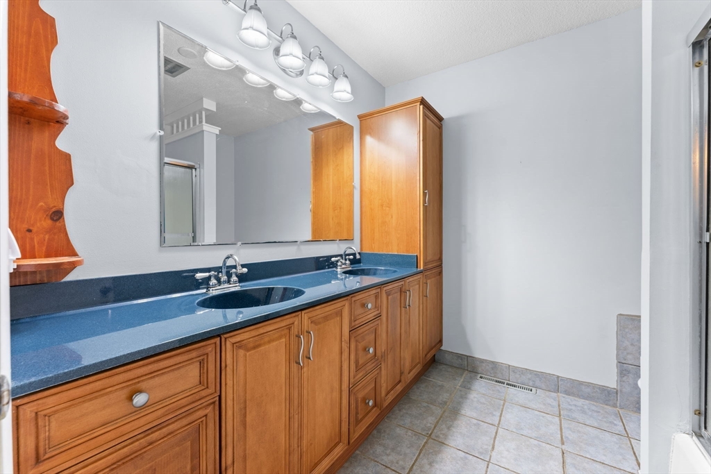 46 Highland Road Boxford, MA 01921 - Photo 28 of 41 a bathroom with a granite countertop sink and a mirror