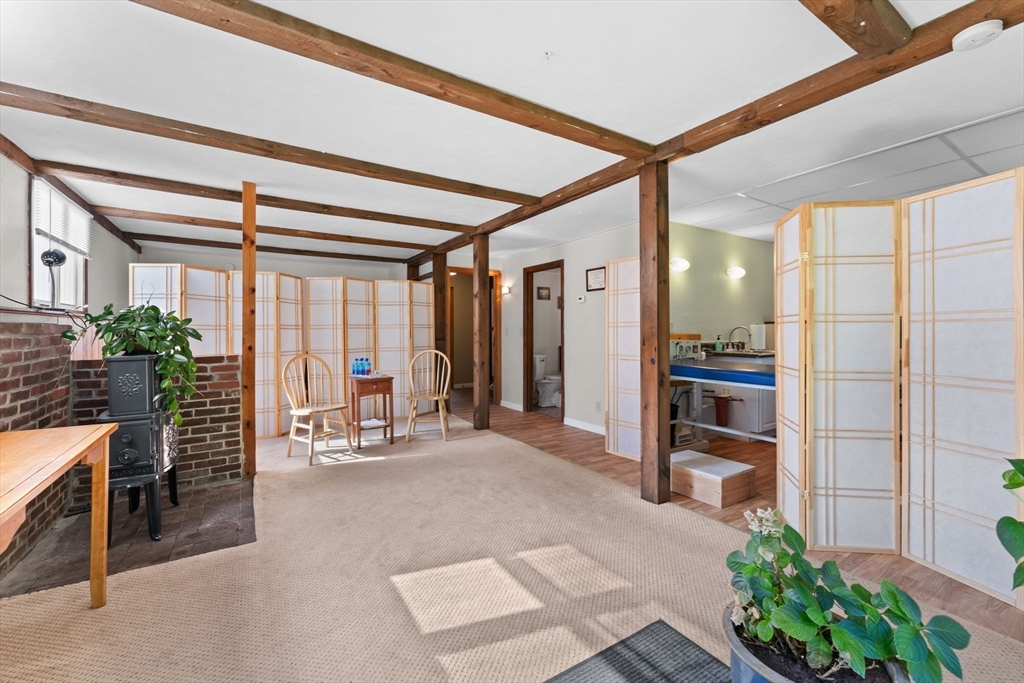 46 Highland Road Boxford, MA 01921 - Photo 29 of 41 a view of a livingroom with furniture and windows