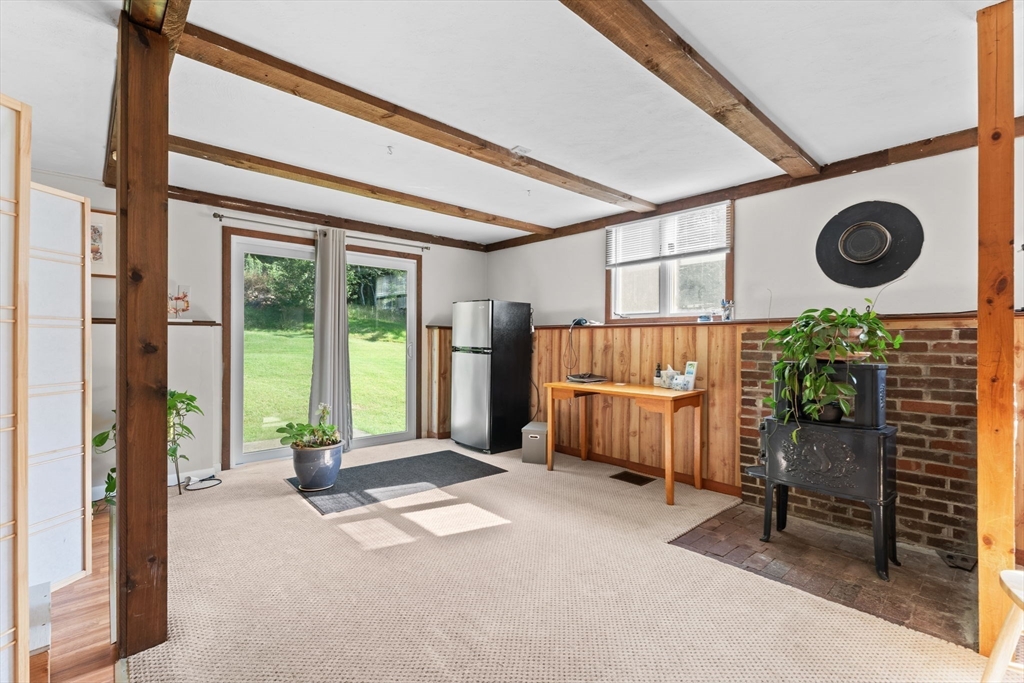 46 Highland Road Boxford, MA 01921 - Photo 31 of 41 a living room with a couch and a large window