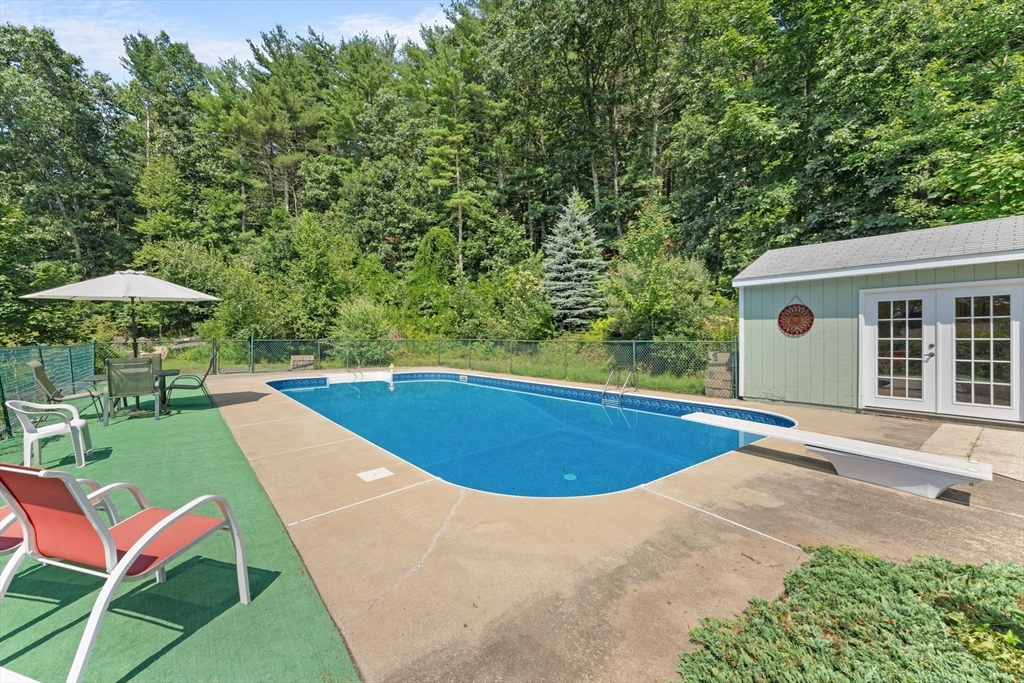 46 Highland Road Boxford, MA 01921 - Photo 38 of 41 a view of a backyard with furniture and a backyard