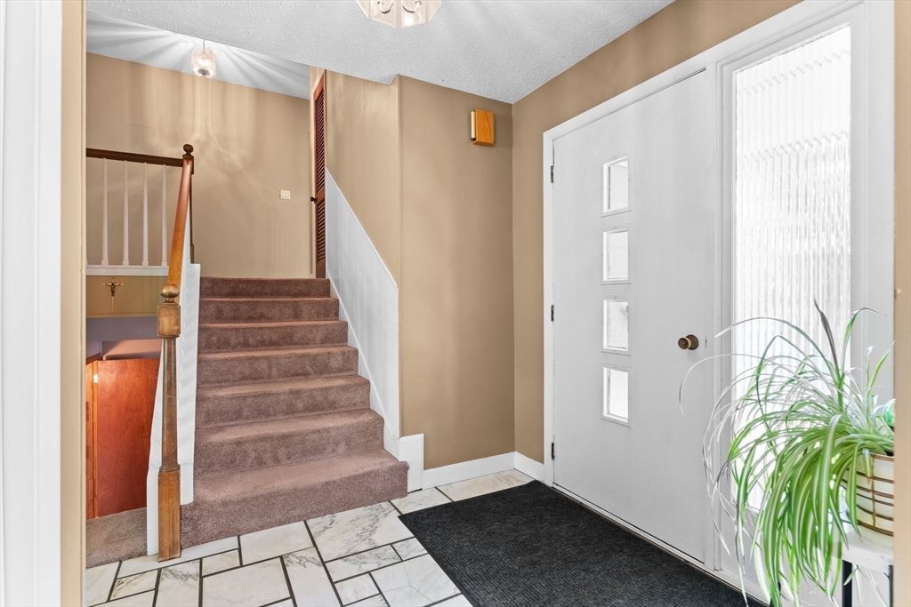 46 Highland Road Boxford, MA 01921 - Photo 5 of 41 a view of entryway with wooden floor and door