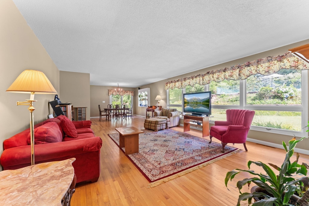 46 Highland Road Boxford, MA 01921 - Photo 6 of 41 a living room with furniture and a flat screen tv