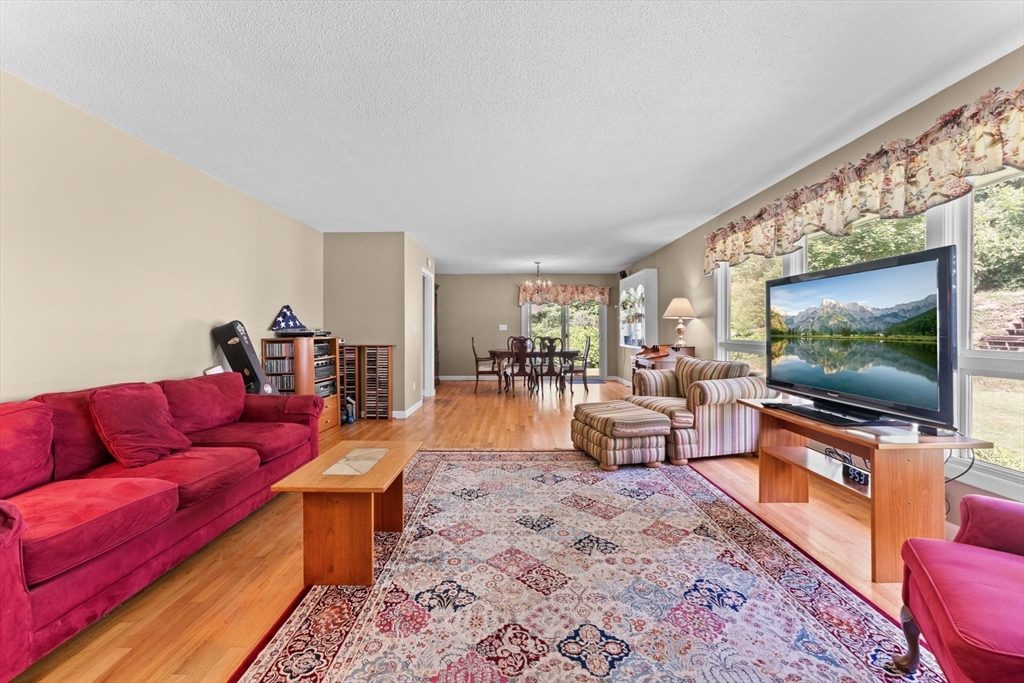 46 Highland Road Boxford, MA 01921 - Photo 7 of 41 a living room with furniture and a flat screen tv