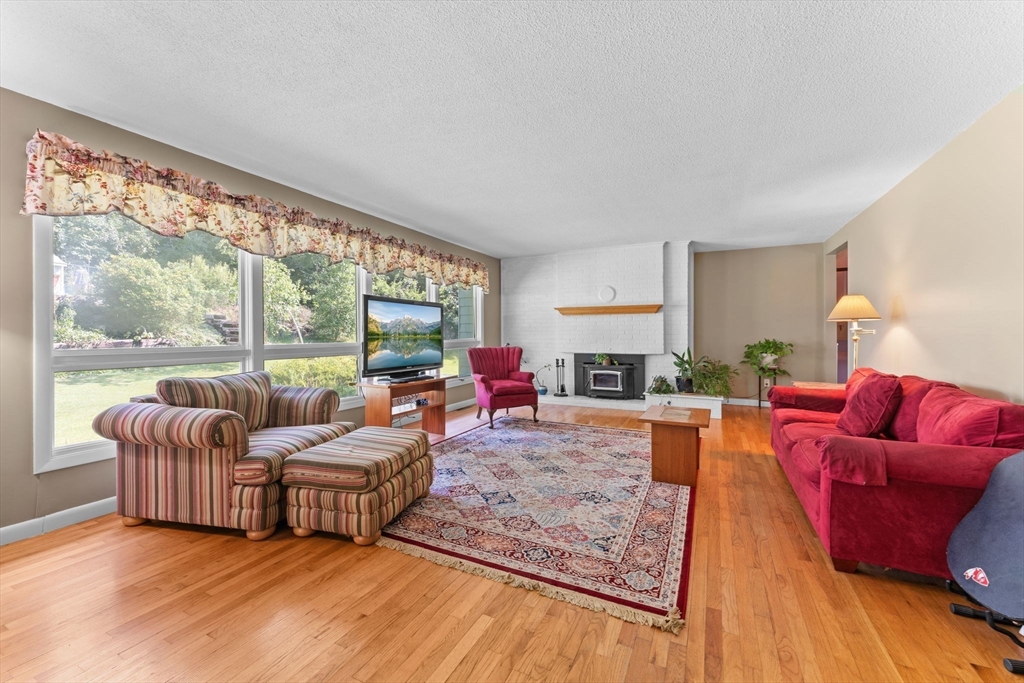 46 Highland Road Boxford, MA 01921 - Photo 8 of 41 a living room with furniture and a large window