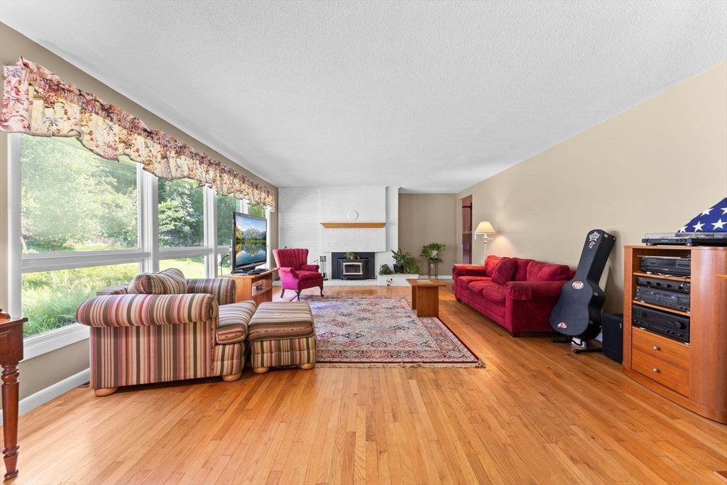 46 Highland Road Boxford, MA 01921 - Photo 9 of 41 a living room with furniture and a large window