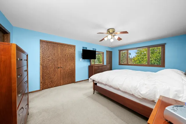 a bed room with a bed and a tv