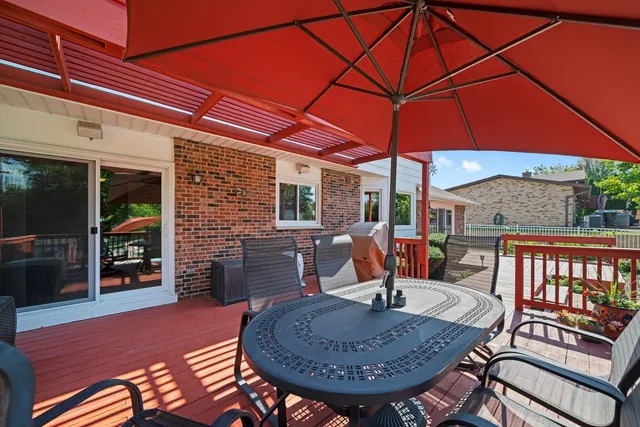 a view of a chairs and table in the patio