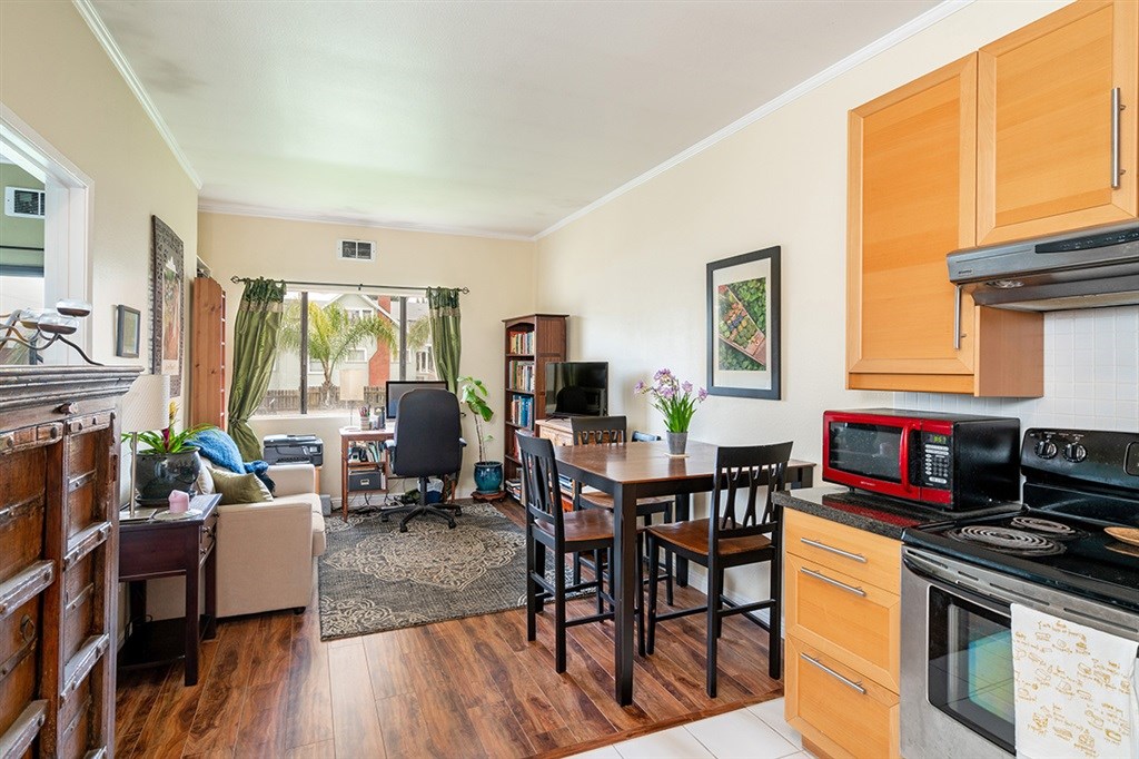 2650 Broadway, Unit 314 San Diego, CA 92102 - Photo 11 of 16 a living room with furniture a fireplace and a table
