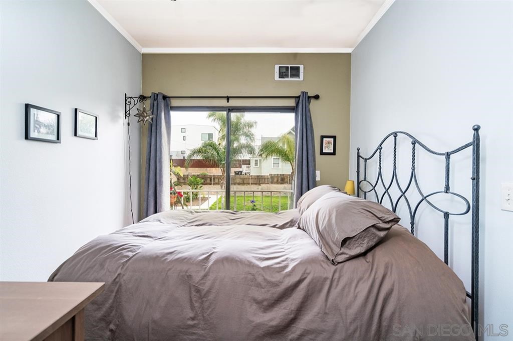 2650 Broadway, Unit 314 San Diego, CA 92102 - Photo 12 of 16 a bedroom with a bed and large window