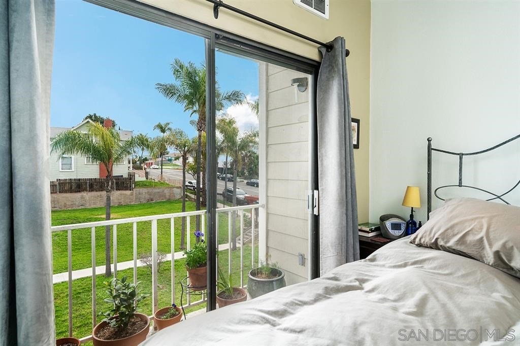 2650 Broadway, Unit 314 San Diego, CA 92102 - Photo 13 of 16 a bedroom with a bed and a potted plant