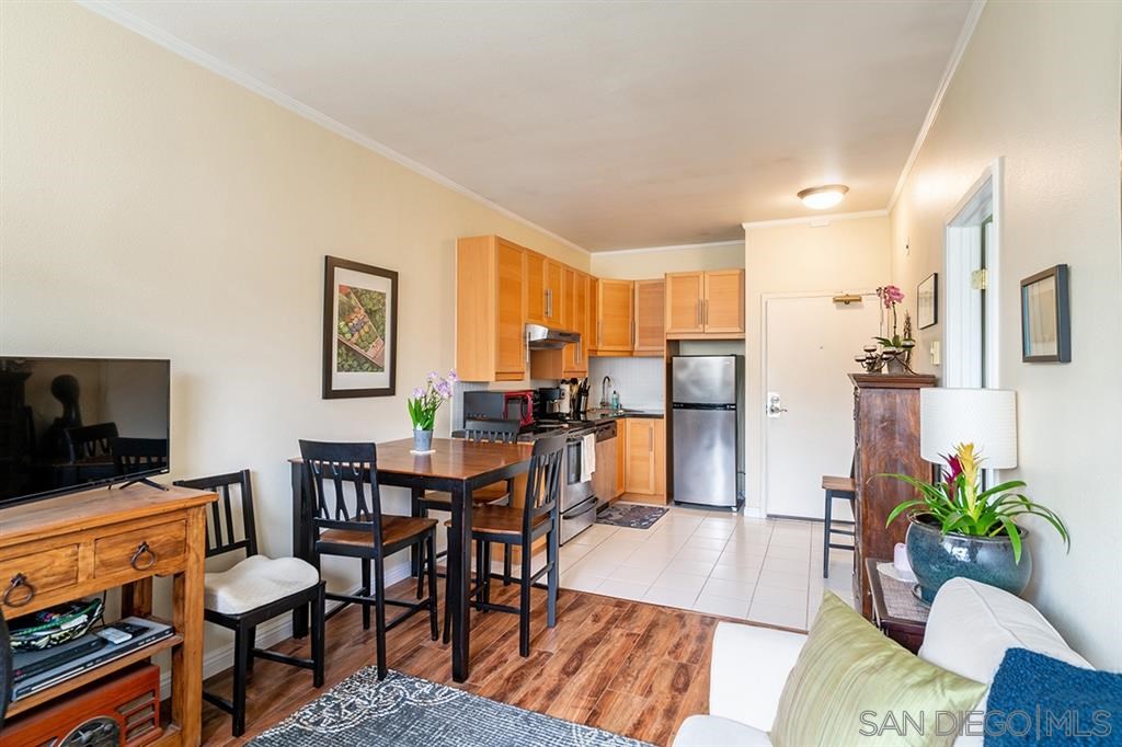 2650 Broadway, Unit 314 San Diego, CA 92102 - Photo 4 of 16 a living room with furniture and a flat screen tv