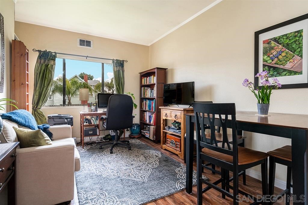 2650 Broadway, Unit 314 San Diego, CA 92102 - Photo 8 of 16 a living room with furniture a rug and a flat screen tv