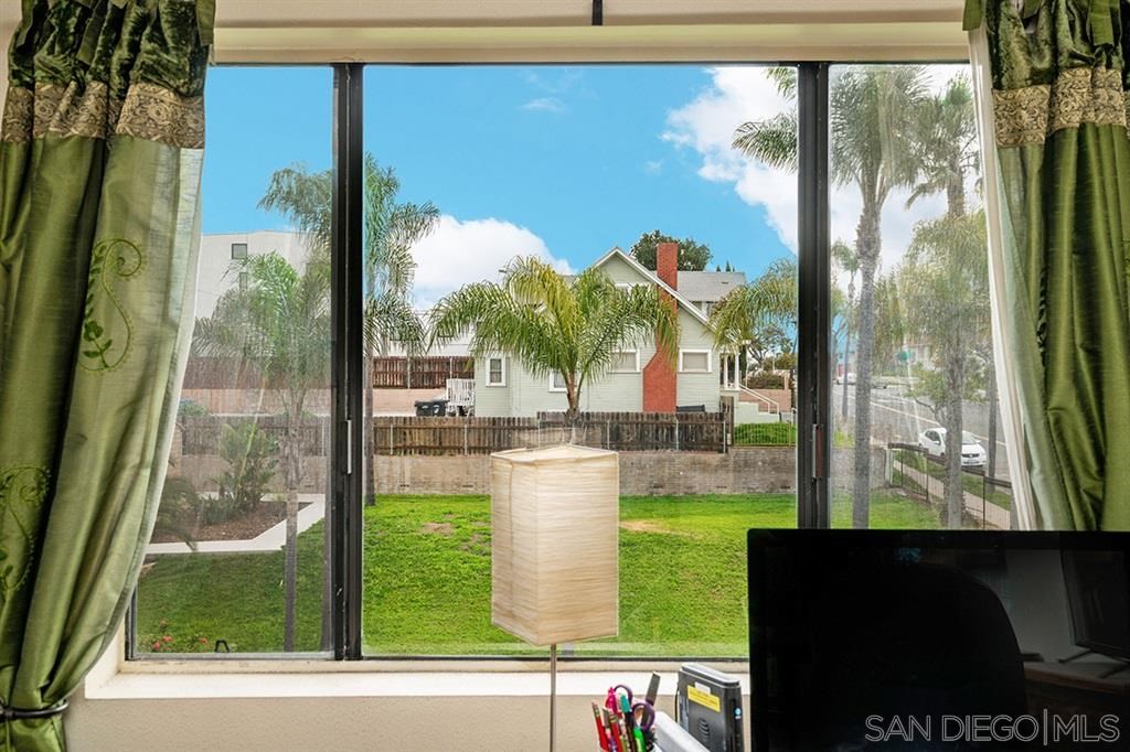 2650 Broadway, Unit 314 San Diego, CA 92102 - Photo 10 of 16 a view of a porch with a floor to ceiling window next to a yard