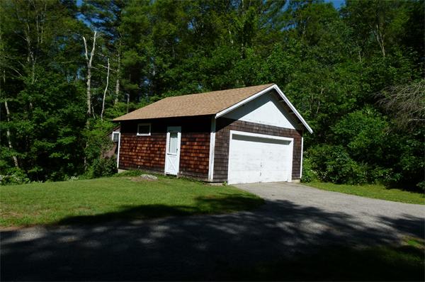 128 Main Street Boxford, MA 01921 - Photo 2 of 6 a front view of a house with a garden