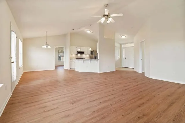 a view of a kitchen with a dishwasher kitchen stove and cabinets