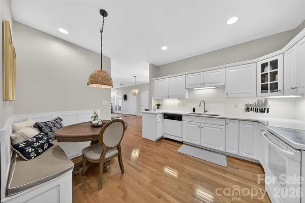 a kitchen with a sink cabinets and window