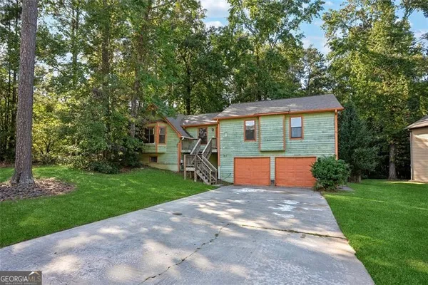a front view of a house with yard