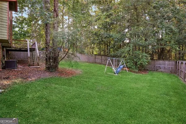a view of a backyard with a slide