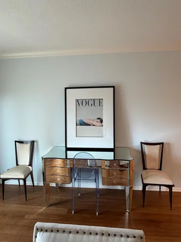 a view of a livingroom with furniture and wooden floor