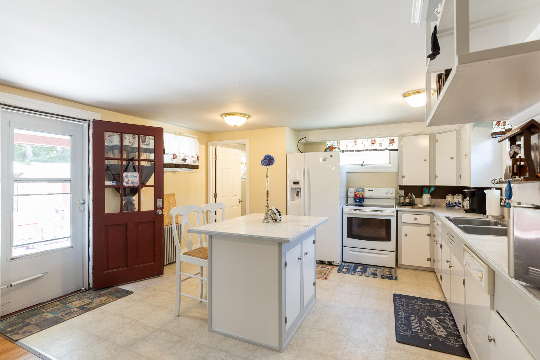 64 Murphy Road Hyannis, MA 02601 - Photo 15 of 64 a kitchen with a sink stove and refrigerator