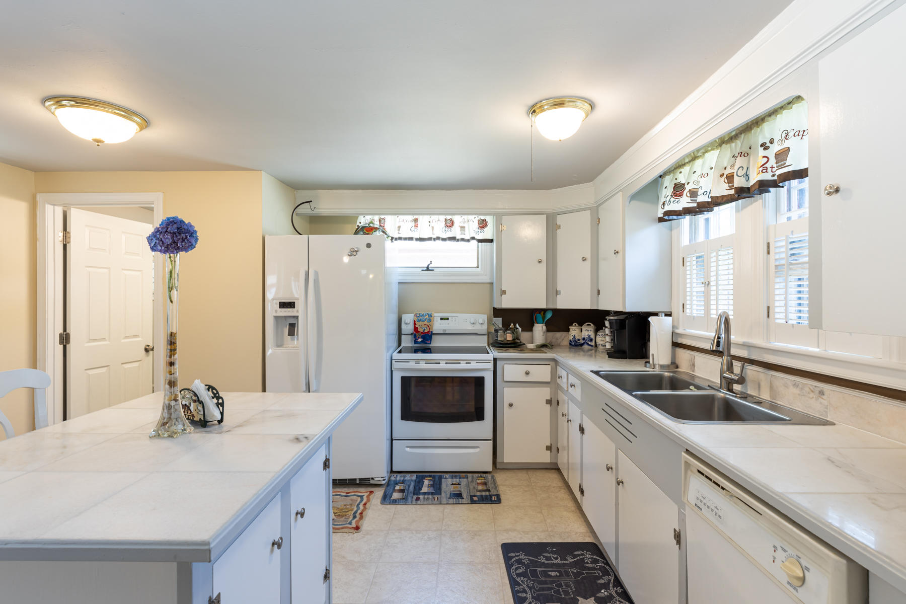 64 Murphy Road Hyannis, MA 02601 - Photo 17 of 64 a kitchen with a sink stove and cabinets