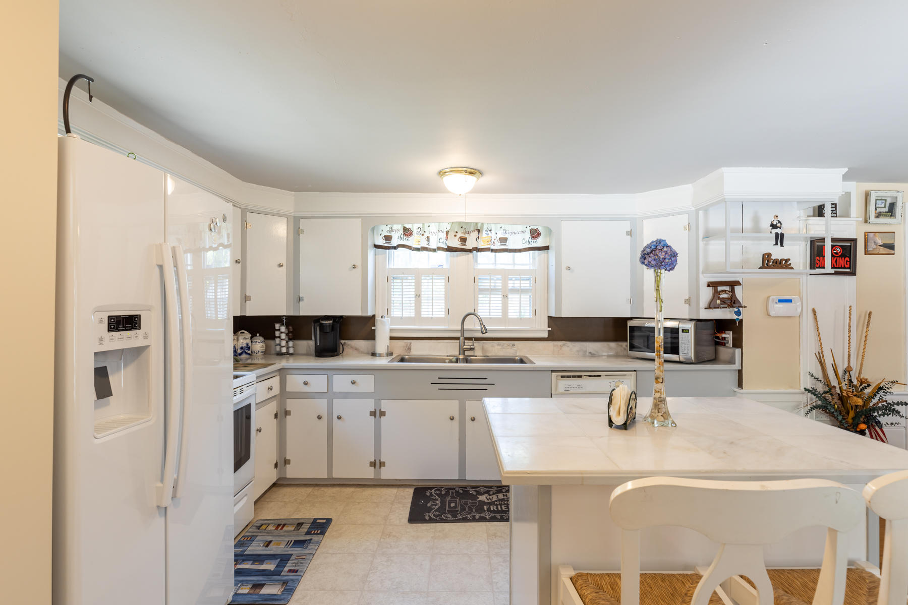 64 Murphy Road Hyannis, MA 02601 - Photo 18 of 64 a kitchen with a sink a stove a refrigerator and cabinets