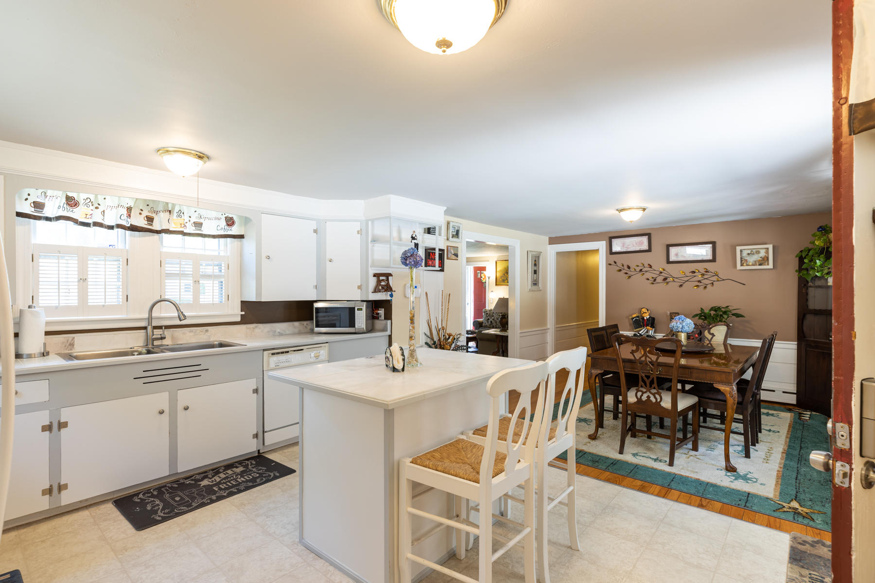 64 Murphy Road Hyannis, MA 02601 - Photo 19 of 64 a large kitchen with a table and chairs