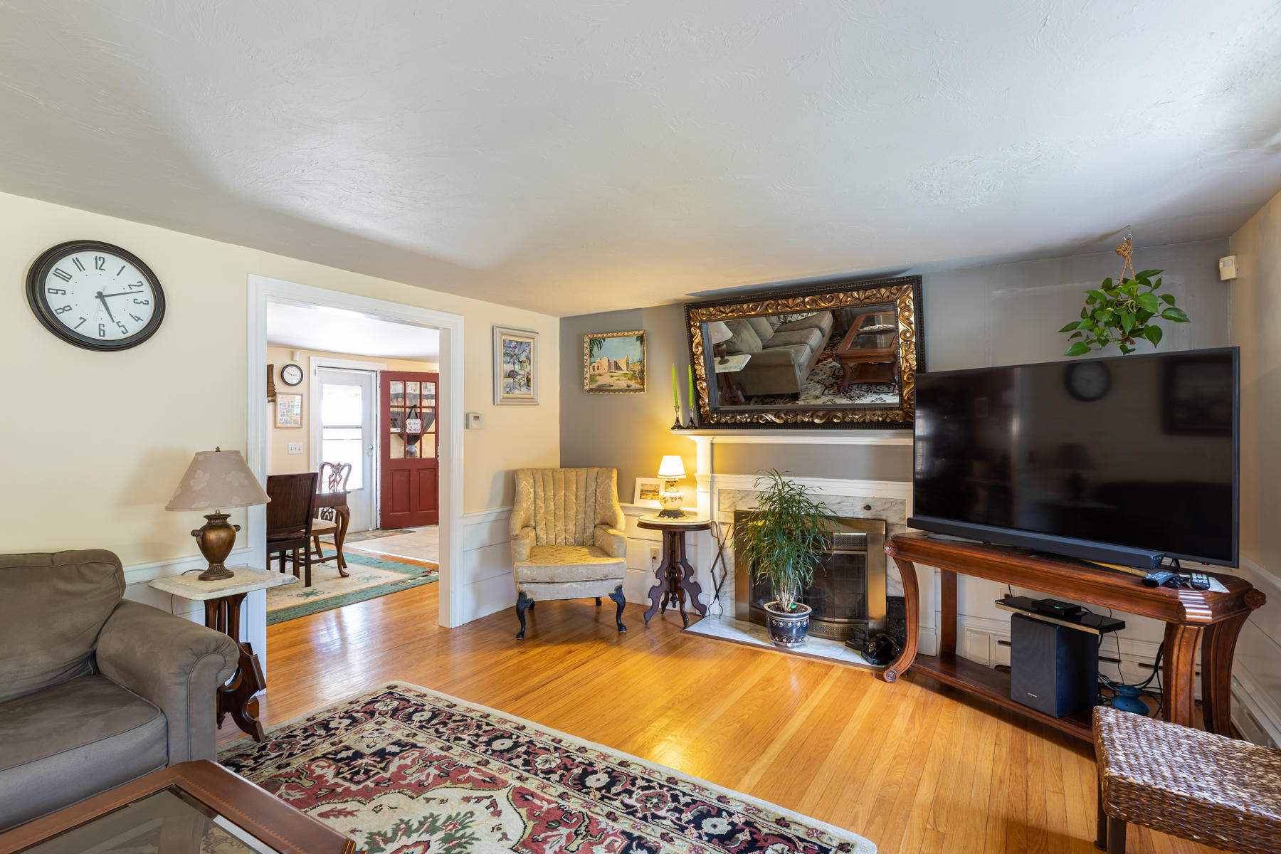 64 Murphy Road Hyannis, MA 02601 - Photo 2 of 64 a living room with furniture and a flat screen tv